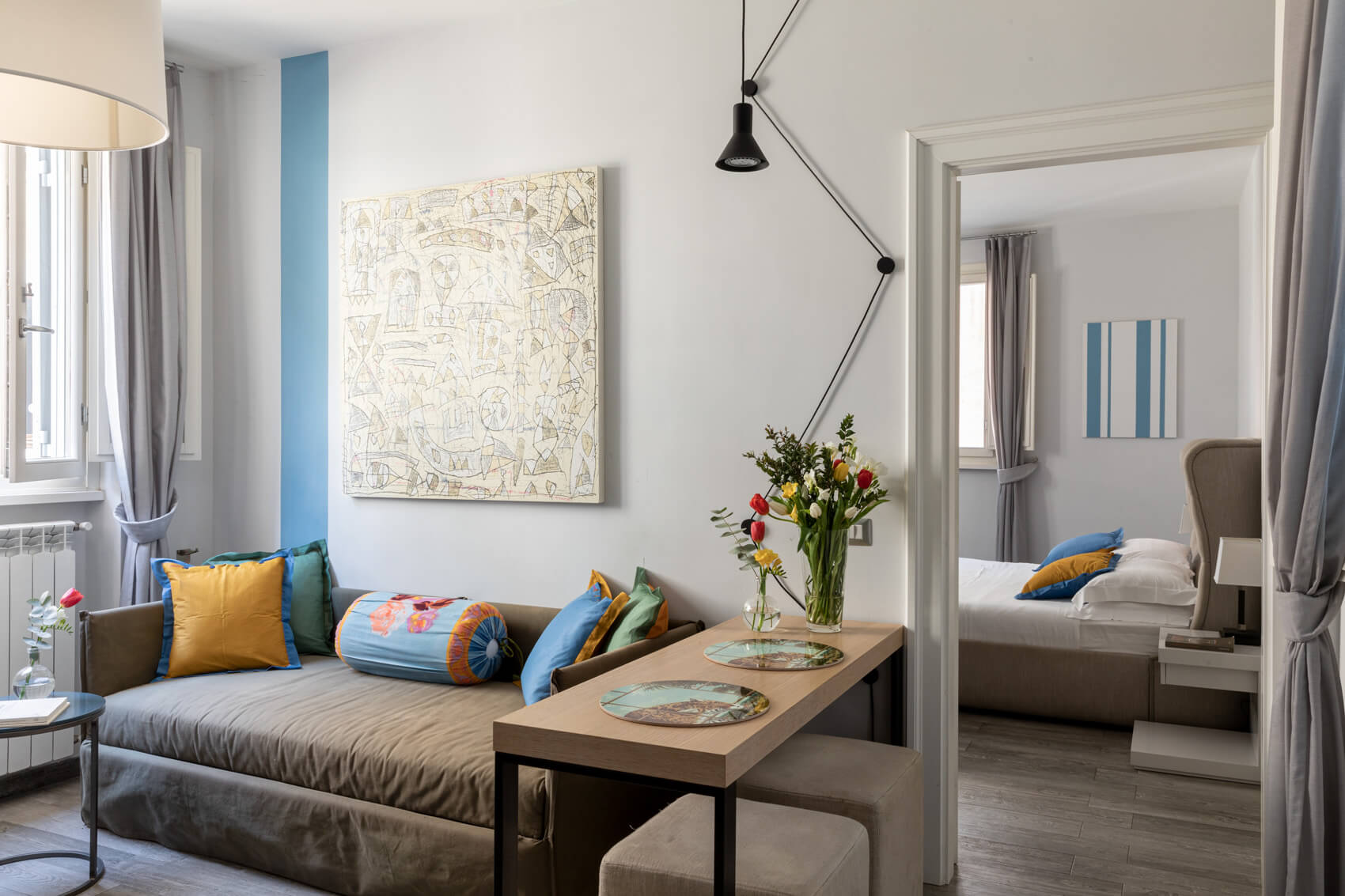 Salotto con angolo cottura dell’Appartamento Chez a Now Apartments Roma centro